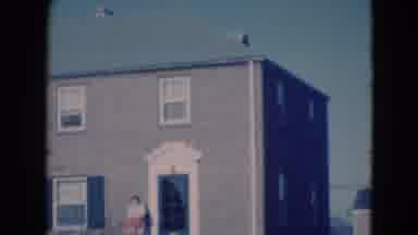 Middletown Pennsylvania (1975): Two Story Building With Towers And A Lady In Front
