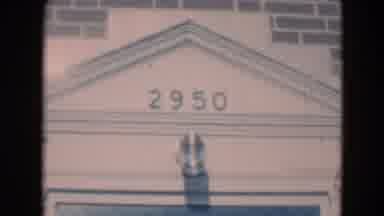 Middletown Pennsylvania (1975): A Woman Standing By The Door Inside The Building