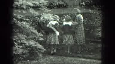 Milwaukee Wisconsin USA (1975): Girls Doing Cartwheels Over Girls Picking Flowers