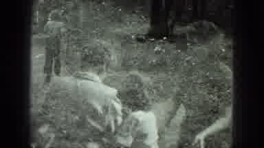 Milwaukee Wisconsin USA (1975): Two Children Help An Older Woman Walk Down The