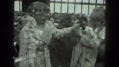 Milwaukee Wisconsin USA (1975): Multiple Exposure Video Two Girls Play With Pet
