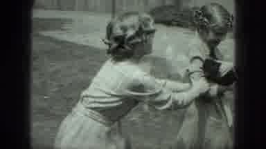 Milwaukee Wisconsin USA (1975): Two Girls In Dresses Playing With And Fighting