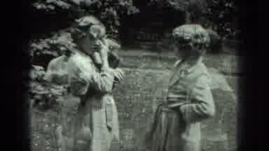 Milwaukee Wisconsin USA (1975): Two Women Talking While One Fixes Her Hair And