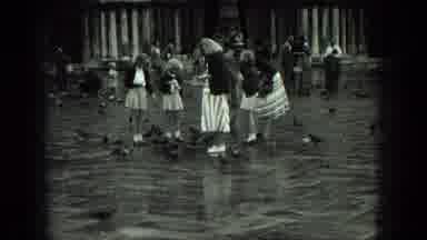 Venice Italy-1975: Women And Children Feeding Pigeons In A Large Courtyard With