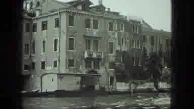 VENICE ITALY-1975: Historic Boat Ride Through Canals With Man Rowing and Girl Gazing