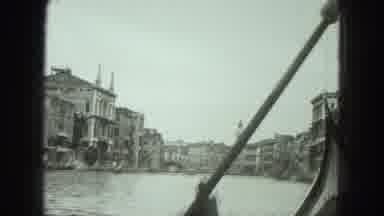Venice Italy (1975): Man Rows A Boat Down The Canal For The Camera