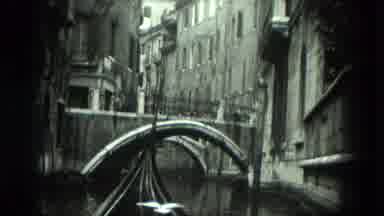 Venice Italy (1975): Shot Of A Moving Gondola In Venice Italy Including A Bridge