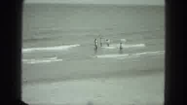 Venice Italy (1975): Black And White Long-Range Footage Of Four People Wading In