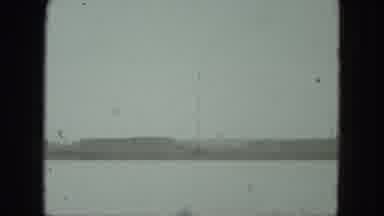 Milwaukee Wisconsin USA-1975: Girl Unwraps Gift With View Of Coastal City On A