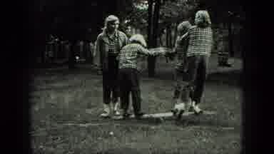 Milwaukee Wisconsin USA (1975): A Mom Watching Her Kids Playing In The Park