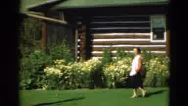 Duluth Minnesota USA (1975): Woman Wearing Red And White Shirt Walks On Green