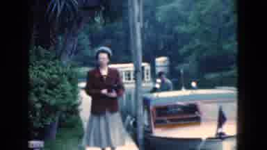 Florida USA (1975): A Woman Walks Along A Canal Looking At Boats Moving