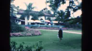 Florida USA (1975): Well Dressed Men And Women Walk Around The Garden In Front Of