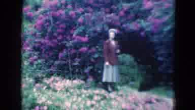 Florida USA (1975): Young Women Standing In A Beautiful Garden In Front Of Flowers
