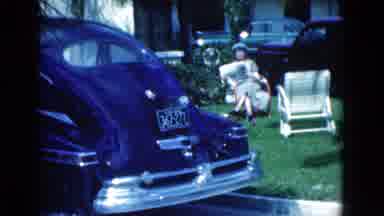 Florida USA (1975): Lady Relaxing On The Lawn Next To An Empty Chair Reading A