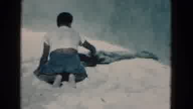 Florida USA (1975): A Man Kneels Next To An Alligator Or Crocodile And Pets It