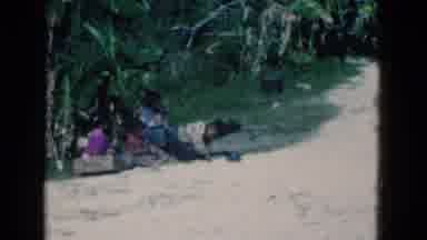 Florida USA (1975): Poor Kids Playing In Sand At Seashore With His Finger