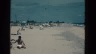 Florida USA (1975): People Enjoying A Sunny Day At The Beach With Waves Rolling In
