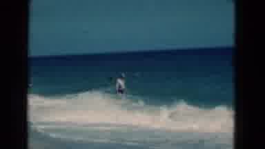 Florida USA (1975): A Man Enjoying The Beach Walking Through The Waves