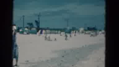 Florida USA (1975): A Sand Beach With People Enjoying Themselves With Their Family