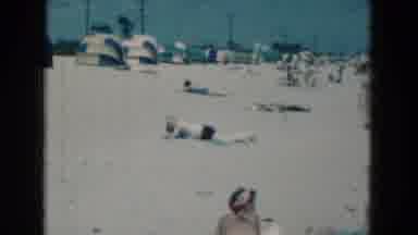 Florida USA (1975): Happy Beach Goers Lay Out Under The Sun On The White Sand