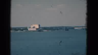 Florida USA (1975): Fish In A Tank Of Green Water Then Pans To Sea