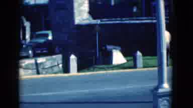 Florida USA (1975): Several Antique Cars Slowly Drive Around The Building On The