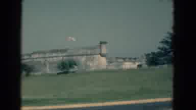 Florida USA (1975): View Of Grey Building With Flags On A Bright Sunny Day