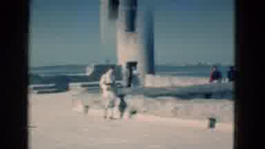 Florida USA (1975): Woman Walking Along The Waterfront On A Windy Day While You