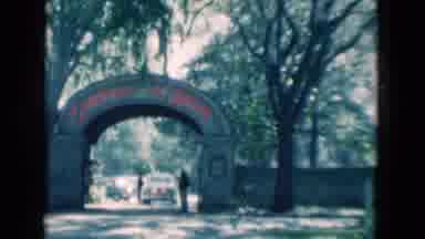 Florida USA (1975): An Entrance With An Arc Structure With A Car Stop In Front
