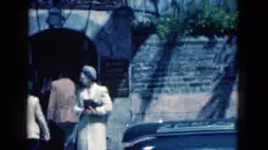 Florida USA (1975): Two People Enter And Also Someone Leaves Through A Side Gate