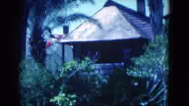 Florida USA (1975): Flags Blowing In The Wind Along With A Brown Gazebo
