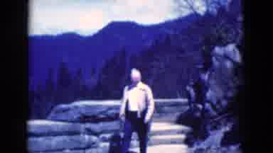 Florida USA (1975): A Man Walking In The Forest Near High Mountain Peaks