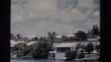 Florida USA (1975): Shot Of Houses Or Mobile Homes Surrounding Lake With Trees And