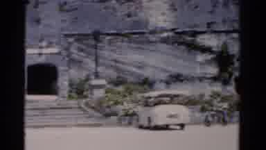 Florida USA (1975): Old Footage Of Cars Parked Outside An Entrance To A Stone