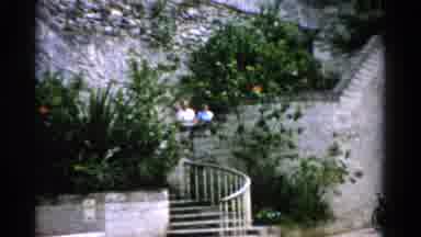 Florida USA (1975): Family Walking Up And Down Stairs Carrying Something Then