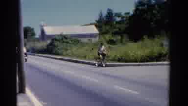 Florida USA (1975): A Person On The Bicycle Cycling Down A Very Quiet Road