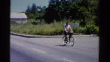 Florida USA (1975): Woman Rides A Bike At The Beach