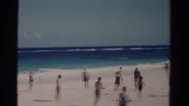Florida USA (1975): Crowded Light Sand Beach Leading The Bright Blue Waters Of The