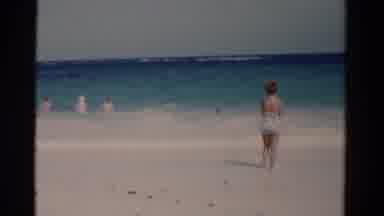 Florida USA (1975): Young Woman Wearing Swimsuit Looking At Ocean Horizon During