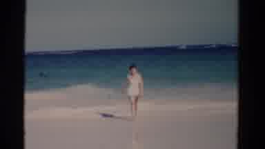 Florida USA (1975): A Lady Walking Towards Me At The Beach By Water Front