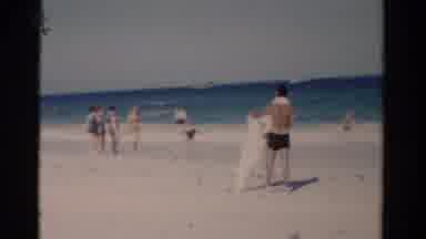 Florida USA (1975): Several People Have Fun On The Beach Next To The Building