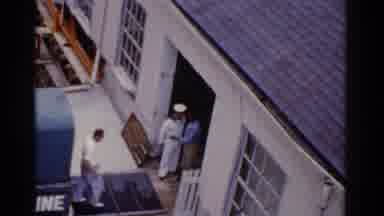 Florida USA (1975): Sailors And Family Walking In To A Building By A Dock