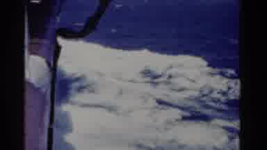 Florida USA (1975): Boat Churns Through Deep Blue Sea Water On A Bright Sunny Day