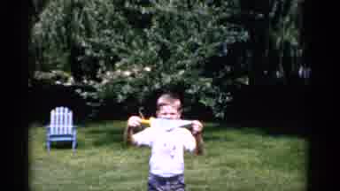Florida USA (1975): Child With Pennant Flag And Mustache Standing In Grass With