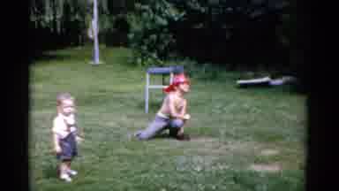 Florida USA (1975): Boy Wearing Red Hat Throws White Ball On A Clear Sunny Day