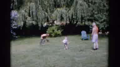 Florida USA (1975): Older Man Helping A Young Boy Practice Baseball And Looking