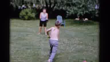 Florida USA (1975): Two Kids Practice Tossing The Baseball And Swinging The Bath