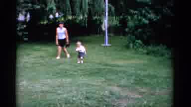 Florida USA (1975): Mother And Toddler Child Are Walking Outside On A Sunny Day