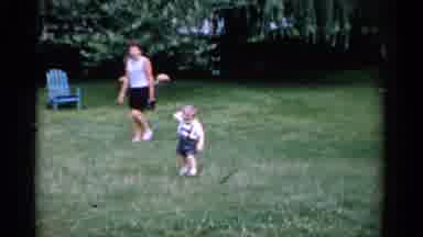 Florida USA (1975): The Cute Family Playing In The Cricket In Garden The Little